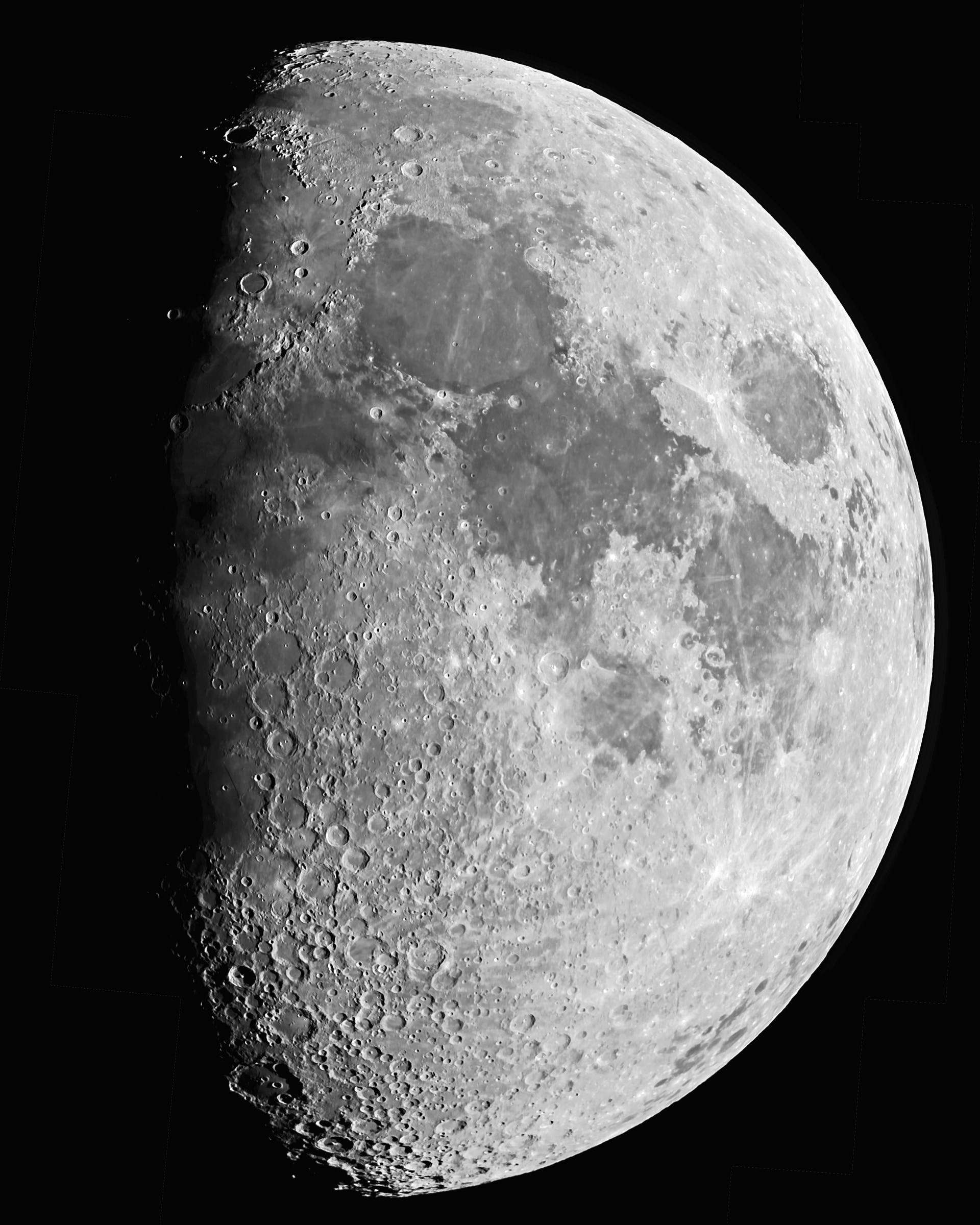 A gibbous Moon in sharp detail, with dark maria and cratered highlands along the shadow line.